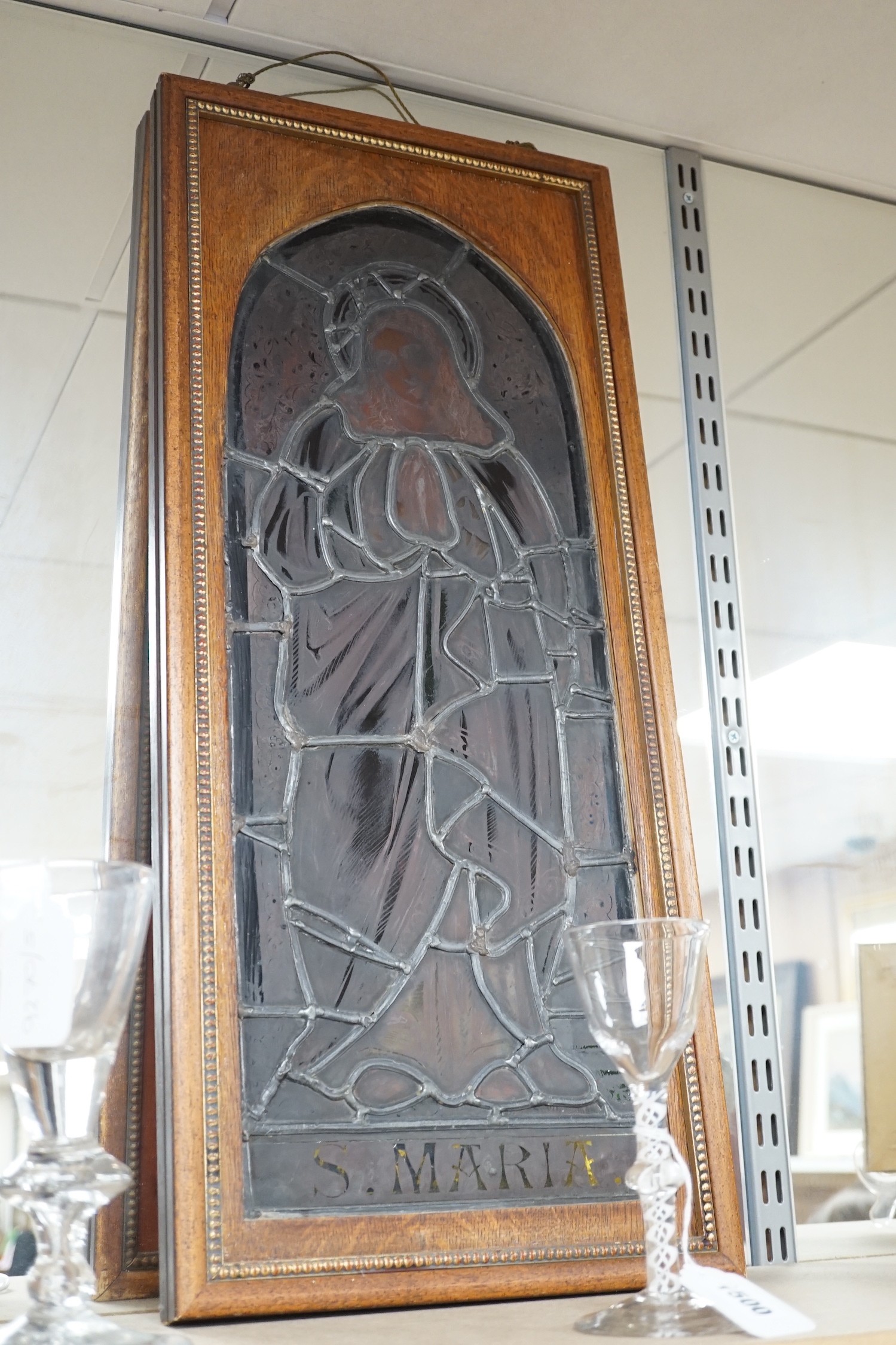 A pair of Victorian framed stained glass panels of St. Martin and St. Simon. 68.5cm tall